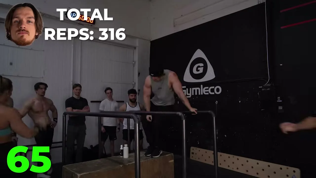 Bruno Zgela resting in the top position on dip bars during the endurance challenge