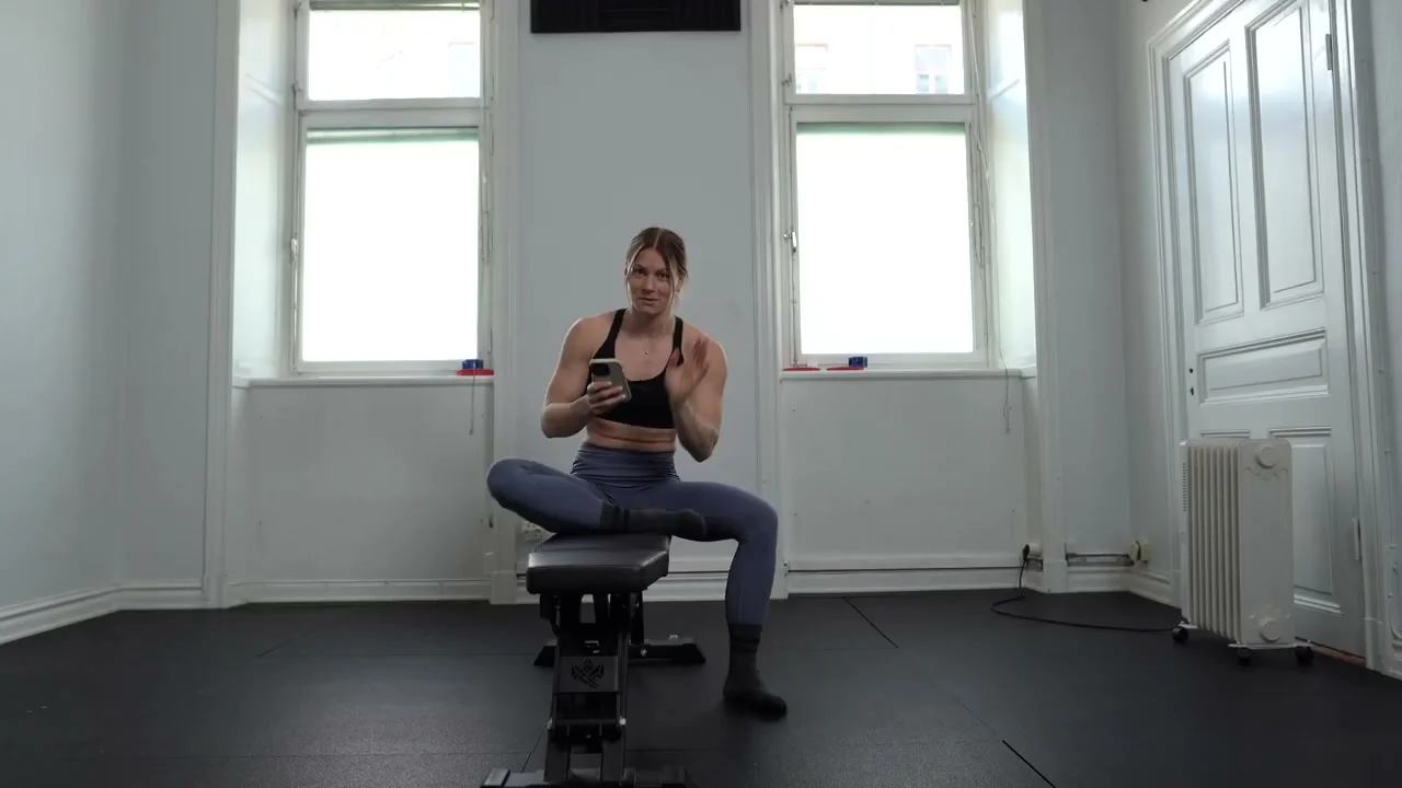 Malin performing a deep squat mobility flow during the irony challenge